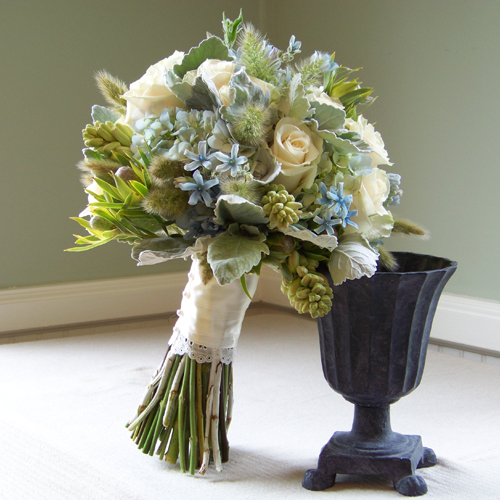 Bridal bouquet with tweedia, hydrangea, dusty miller, Vendela roses, bunny tail grass, tuberoses and Leucadendron Pisa