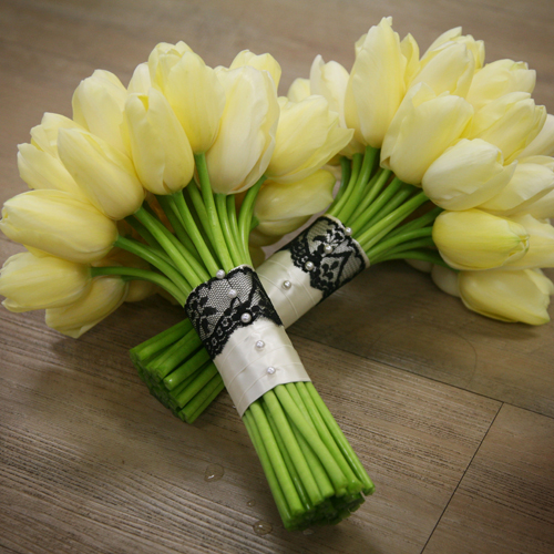 bridesmaids' bouquets with ivory Maureen French tulips and a black lace and ivory satin stem wrap