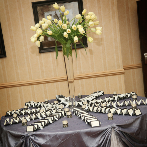 A tall centerpiece of Maureen French tulips graced the escort card table